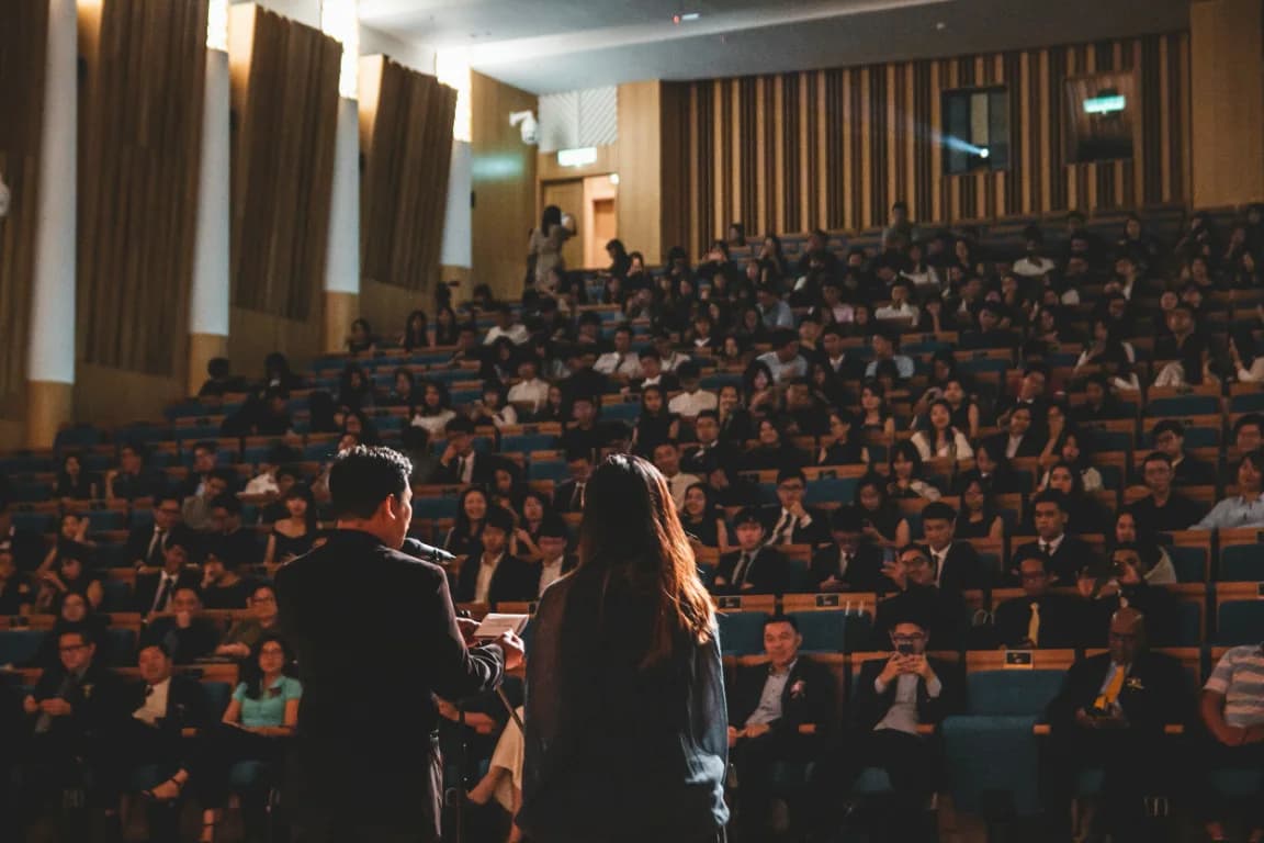 Students and educators gathered in a large auditorium